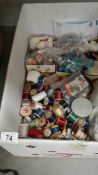 A large box of vintage threads and other needlework related items.