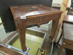 A carved oriental table.