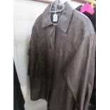 A brown leather coat with embroidered front panels, size 18.