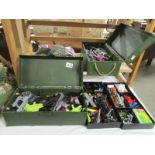 2 Action man foot lockers with clothes and weapons.