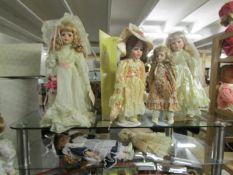 7 porcelain headed collector's dolls.