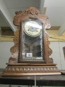 A carved mantel clock.