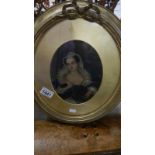 An oval gilt framed and glazed portrait of a lady.