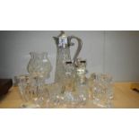 A glass claret jug, a glass candle lamp, a pair of candlesticks and a pair of salts.