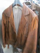 A brown fringed leather jacket, size small.