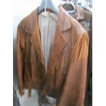 A brown fringed leather jacket, size small.