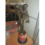 A bronze figure of a dancing lady signed D H Chiparus.