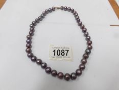 A Honora aubergine pearl necklace.