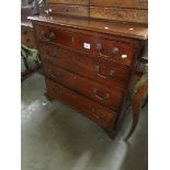 A Georgian mahogany 4 drawer chest with cross banded top.