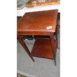 A mahogany inlaid occasional table.