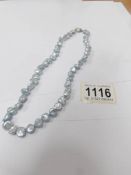 A pale blue Keisha pearl necklace by Honora pearls.