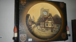 A large mounted illuminating Bossuns wall plaque with clock & side lamps
