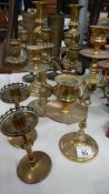 2 brass candelabra, 2 pairs of brass candlesticks and a pair of brass vases.