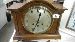 An oak mantel clock.