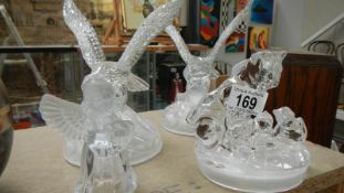 2 glass eagles, a glass angel and a glass dog group.