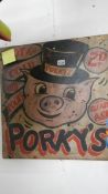 A Porky's fair ground sign.