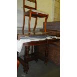 A mahogany extending table & 8 chairs