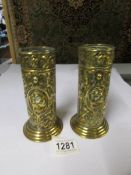 A pair of embossed brass vases (one has split that needs soldering).