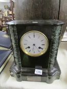 A 19th century black marble mantel clock.