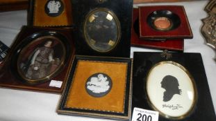 A silhouette, an oval portrait, 3 framed Wedgwood plaques etc.