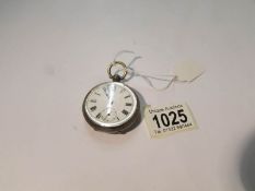 A silver pocket watch with second hand, in working order.