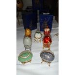 7 boxed egg shaped trinket boxes.