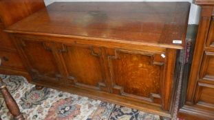 A large oak blanket box.