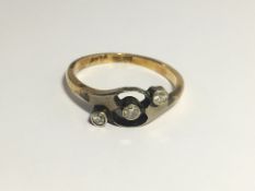 A 3 stone Edwardian 18ct gold and diamond crossover ring, size J.