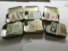 6 tins of approximately 600 Ogden's cigarette cards from a variety of series including boxing,