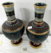 A pair of Mettlach vases in dark green with brown and white floral pattern, Ges Gesch, 1808.