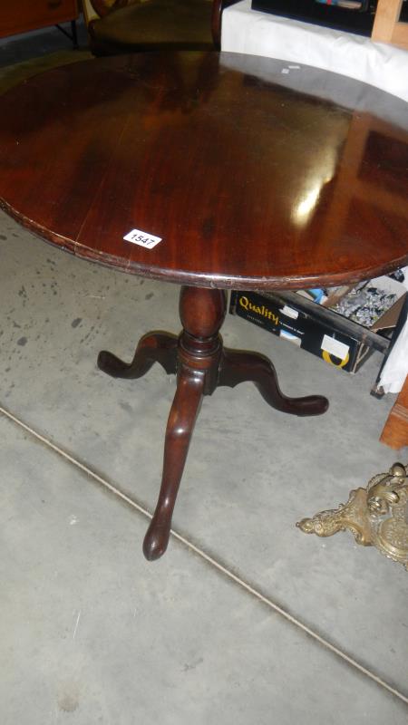 A Victorian bird cage tripod table