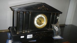 A black mantel slate clock