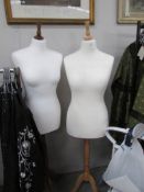 2 white display mannequins.