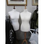 2 white display mannequins.