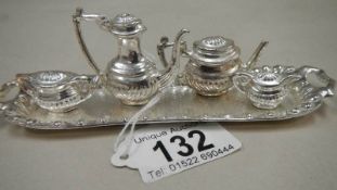 A miniature silver plated tea set on tray.