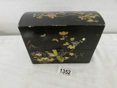 An early 19th century lacquered box with 3 scent bottles.