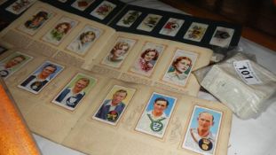 An album of cigarette cards, 2 books of cigarette card and loose cards.