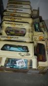 34 models of yesteryear cars in straw boxes.
