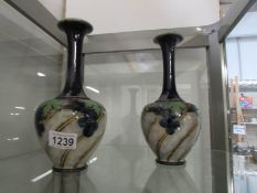 A pair of Royal Doulton vases signed Bessie Newbery adn Margaret G Thompson' No.