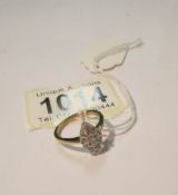 A diamond shaped yellow gold 12 stone diamond ring, size M.