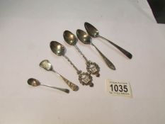 6 assorted silver spoons.