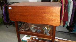 A drop leaf tea trolley.