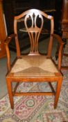 A mahogany elbow chair.
