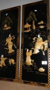 A pair of Japanese lacquered and mother of pearl panels.