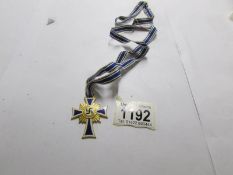 A WW2 German Mother's cross, 3rd issue with gold plated finish.