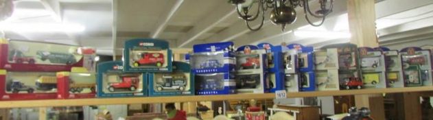 A collection of boxed Lledo and Corgi model vehicles.
