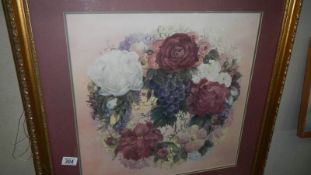 A framed and glazed floral print.