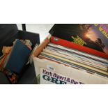 A box of LP records and a case of 45 rpm records.