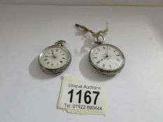 2 vintage chased silver fob watches with enamel faces, early 20th century.