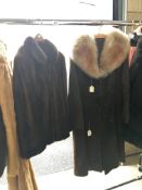 A leather coat (possibly sheep skin) and a fur jacket